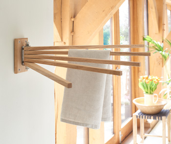 Oak radial towel airer mounted on the wall