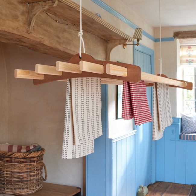 The Arthur clothes airer set in a woodland cottage style setting